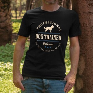 Balanced Dog Trainer T-Shirt: Fit the Training to the Dog. With a vintage style and handsome Belgian Malinois silhouette, its the perfect dog training apparel wear to appointments and lessons. And it makes a classy Malinois dog trainer gift!
