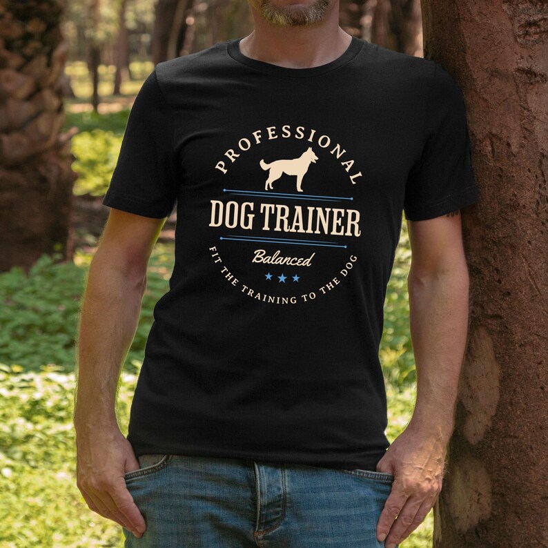 Balanced Dog Trainer T-Shirt: Fit the Training to the Dog. With a vintage style and handsome Belgian Malinois silhouette, its the perfect dog training apparel wear to appointments and lessons. And it makes a classy Malinois dog trainer gift!