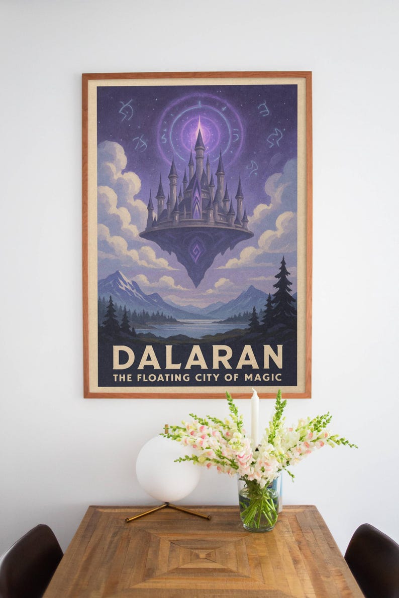 May include: Framed poster featuring a fantasy landscape with a floating castle. The artwork depicts a purple castle above a mountain range and lake, with the text "DALARAN THE FLOATING CITY OF MAGIC" at the bottom. The frame is a light brown color.
