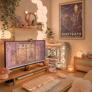 May include: A cozy, well-lit desk setup with a computer, keyboard, and mouse. The desk features a monitor displaying a floral scene, a pink keyboard, and a decorative mushroom lamp. A framed poster reads "SHATTRATH".