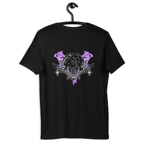May include: Black t-shirt featuring a white graphic design of a purple floral pattern with a circle in the centre.