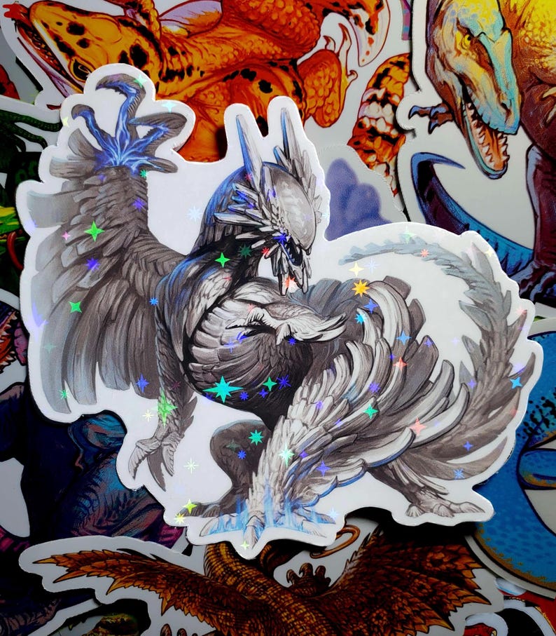 May include: A holographic sticker featuring a detailed illustration of a white and gray mythical creature with wings spread wide. The creature has a fierce expression and appears to be in mid-flight. The sticker has a sparkly, iridescent finish.