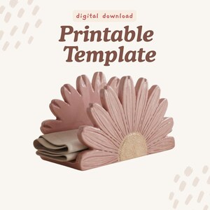 May include: A pink ceramic napkin holder shaped like a daisy flower with a textured center, holding folded beige napkins. The image includes the text digital download Printable Template in brown font against a light background.