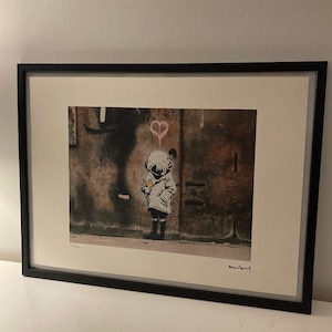 BANKSY: framed and hand numbered lithograph with a certificate