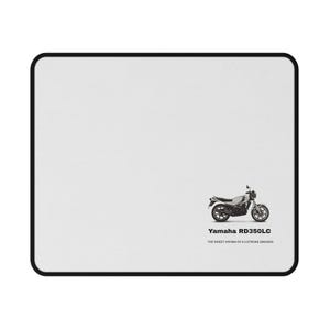 May include: White rectangular mouse mat with a black border. A black and white illustration of a Yamaha RD350LC motorcycle is on the right side. Text below the motorcycle reads "Yamaha RD350LC" and "THE SWEET AROMA OF A 2 STROKE SMOKER!"