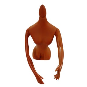 May include: A brown mannequin torso with articulated arms and hands. The mannequin has a slender waist and a smooth, glossy finish. The arms are positioned in a relaxed, downward pose, and the hands are open.