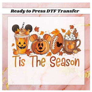 May include: A DTF transfer design featuring fall-themed elements. It includes a pumpkin spice latte with mouse ears, a jack-o'-lantern pumpkin, a football, and a mug of hot cocoa. The text "Tis The Season" is displayed in orange.