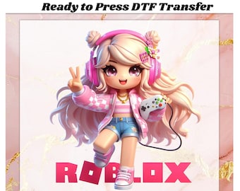 May include: A digital graphic of a cartoon girl with blonde hair, wearing pink headphones, a pink jacket, and denim shorts. She holds a game controller and makes a peace sign. The word "ROBLOX" is displayed in pink block letters. The text "Ready to Press DTF Transfer" is at the top.