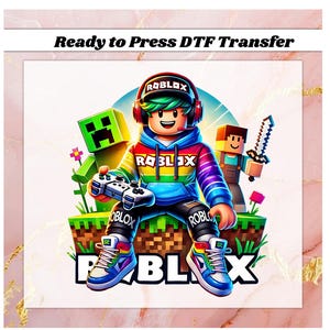 May include: A colorful DTF transfer featuring a Roblox character with a controller, surrounded by Minecraft-inspired figures. The design includes the Roblox logo, rainbow accents, and the text "Ready to Press DTF Transfer".