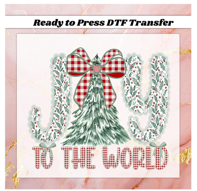 May include: A Christmas-themed DTF transfer design with the words "JOY TO THE WORLD". The design features a Christmas tree, a red and white plaid bow, and the letters "J" and "Y" decorated with green leaves and red berries.
