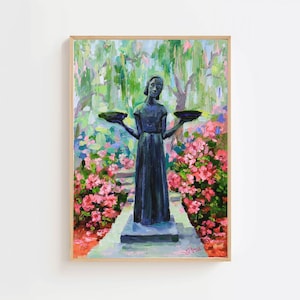 May include: A framed painting depicts a dark statue of a woman holding two shallow bowls, set in a garden path lined with pink flowers. The background features a lush green canopy and colorful brushstrokes, creating a vibrant, impressionistic scene.