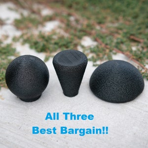 May include: Three black, textured, 3D printed gear shift knobs. The knobs are round, cone-shaped, and dome-shaped. The text "All Three Best Bargain!!" is written below the knobs.