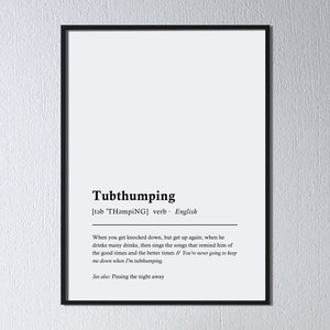 May include: Black and white typography poster with the definition of the word "Tubthumping" in English. The definition reads: "When you get knocked down, but get up again; when he drinks many drinks, then sings the songs that remind him of the good times and the better times // You're never going to keep me down when I'm tubthumping."