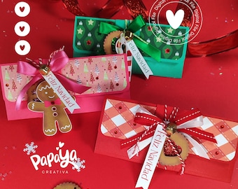 May include: Three Christmas gift boxes with red, pink, and green paper. Each box has a different design and includes a ribbon and a tag that says "Feliz Navidad".