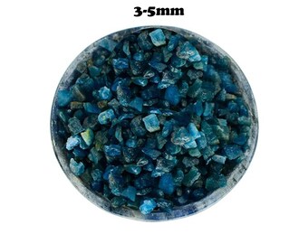 May include: A bowl filled with blue apatite crystal chips, measuring 3-5mm in size.