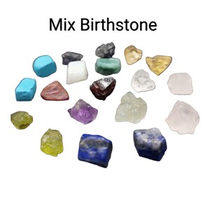May include: A collection of various birthstone crystals in different colors and shapes, including amethyst, turquoise, emerald, ruby, and more.