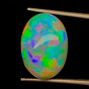 Ethiopian Opal Gemstone: Oval Cabochon Loose Stone (15.5x11MM, 6.70Cts)