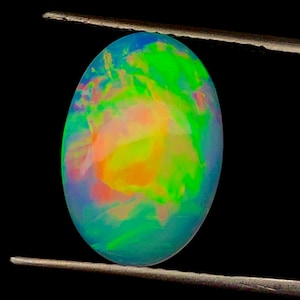 Natural Ethiopian Opal Cabochon: 4.30 Carat Oval Gemstone