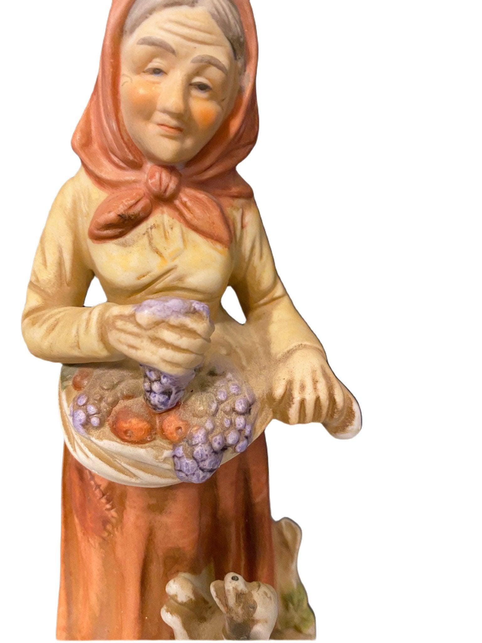 An Old Woman Picking Fruit Bisque Figurine, Picking Fruit, 7.5”