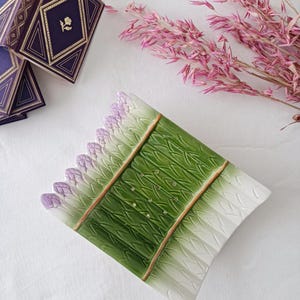 Vintage, antique asparagus dish in slip