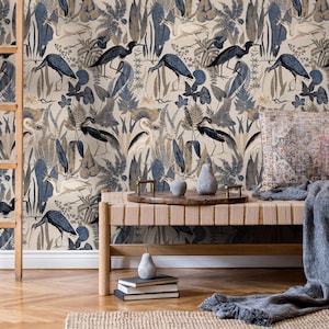 May include: A beige wallpaper with a blue and brown pattern of birds and foliage. The wallpaper is shown in a room with a wooden bench and a gray throw blanket.
