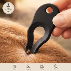 May include: A black tick removal tool is used on a pet's fur. The tool has a loop and a hole for easy handling. The image includes the text "3D Printable STL" and icons for pets, camping, hiking, and travel.
