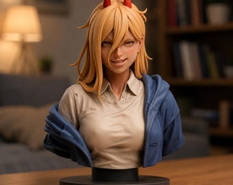 May include: A bust figurine of a character with long blonde hair, two red horns, and amber eyes. The character wears a beige collared shirt under a blue jacket draped over the shoulders. The figure is mounted on a circular black base.