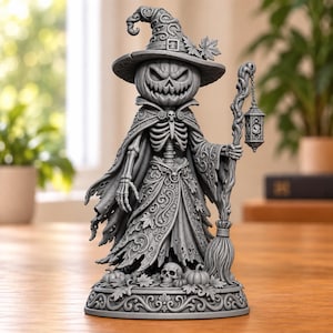 May include: A gray monochromatic figurine of a skeletal figure with a carved pumpkin head wearing a wide-brimmed hat and a flowing cloak. The figure holds a staff with a hanging lantern and stands on a base decorated with skulls and pumpkins.