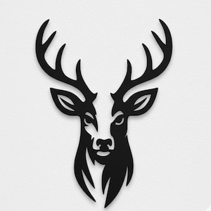 May include: A black silhouette of a deer's head with prominent antlers. The deer's face features detailed eyes, a nose, and a mouth. The artwork is set against a plain white background, creating a strong contrast. Suitable for wall art or home decor.
