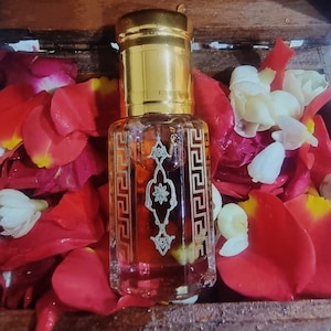 Signature Angelic Attraction Oil (Suited for all types of relationships, career, work advancement, family and good first impression)