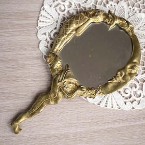 Art nouveau hand mirror with Harlequin, Pierrot and the moon design - Vintage celestial vanity decor - Ornate brass handheld mirror