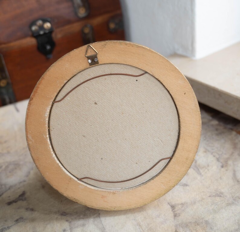Back view of the vintage wood wall picture frame showing the hanging hardware and light backing board.