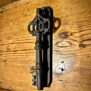Key door knocker