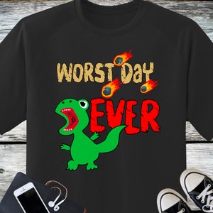 May include: Black t-shirt with a green dinosaur and the text "WORST DAY EVER" in red and white. The dinosaur is roaring and there are small fireballs falling from the sky.