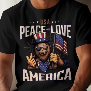 Patriotic Bigfoot Shirt, 4th of July Peace Love America Shirt, USA Flag Sasquatch Shirt, Sasquatch Independence Day Tee, Bigfoot Lover Shirt