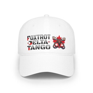 May include: White baseball cap featuring a black and grey graphic of a moose wearing boxing gloves. The graphic also includes the text "FOXTROT DELTA TANGO" and a Canadian flag.