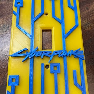 Placa de interruptor de luz con temática ciberpunk