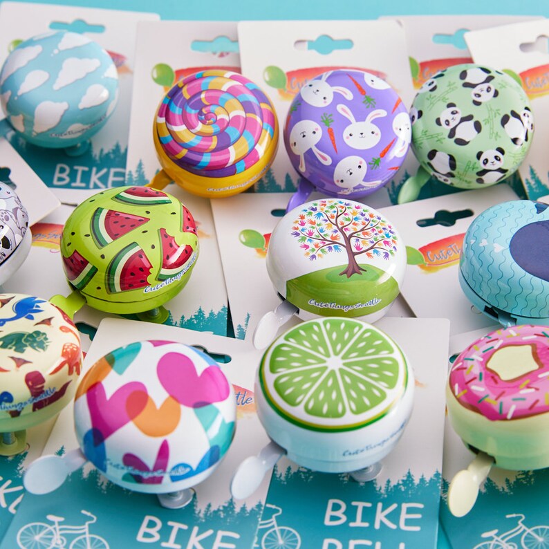 group of cute bike bells with packaging -cute bike accessories - bicycle accessory - biker gift - gift for bike rider - birthday gift - bicycle bell - Cute Things Seattle bike bell - holiday gifts, wheelchair accessories, cycling gifts