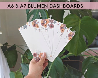 May include: A set of five floral patterned A6 and A7 dashboards. The dashboards are white with a border of orange, red, and blue flowers.