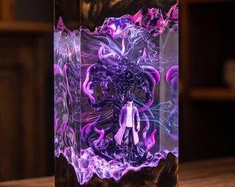 May include: A rectangular resin lamp featuring a dark wood base and top with a clear center section. Inside the transparent resin, a small figure stands surrounded by swirling purple and black smoke-like patterns illuminated from within.