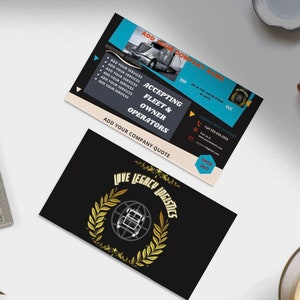 May include: A black and gold business card with the text "Love Legacy Logistics" in a gold circle with laurel wreaths. The card also features a small image of a semi-truck.