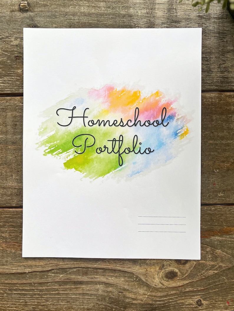 May include: A white sheet of paper with a watercolour background in shades of pink, yellow, green, and blue. The text "Homeschool Portfolio" is written in black cursive font. There are two blank lines at the bottom of the page.