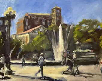 Puede incluir: Una pintura que representa una fuente en una plaza de la ciudad, con edificios en el fondo. La fuente es blanca, mientras que los edificios son marrones y rojos. También hay árboles y personas en la escena.