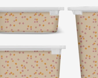 May include: Three plastic containers with white lids. The containers are different sizes and have a beige background with a pattern of orange and pink dots.