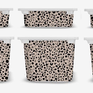 May include: Set of six plastic storage containers with a black and beige leopard print design.
