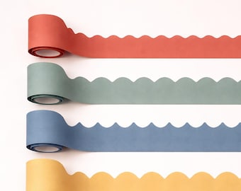 May include: Six rolls of scalloped edge paper border trim arranged vertically. The colors include coral, sage green, dusty blue, mustard yellow, light pink, and deep rose. Each roll features a continuous wavy edge design along one side.