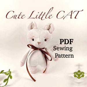 May include: A white plush cat toy with brown ribbon. The toy is standing on a white surface. The text "Cute Little CAT" is at the top of the image. The text "PDF Sewing Pattern" is at the bottom of the image.