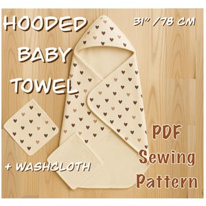 May include: Cream-colored hooded baby towel with a heart pattern, plus a matching washcloth. The towel measures 31 inches (78 cm) and includes a PDF sewing pattern. The text on the image reads "Hooded Baby Towel + Washcloth".