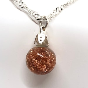 Vintage Sterling silver floating goldstone necklace