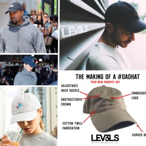 May include: A close-up of a khaki dad hat with a red embroidered rose on the front. The hat has an unstructured crown, a curved brim, and an adjustable back buckle. The hat is made of cotton twill and features the text "LEV3LS" and "Lev3ls Enterprise Inc." on the back.